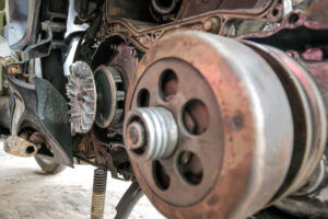 mechanics,service,the,cvt,system,on,motorbikes,in,a,workshop.